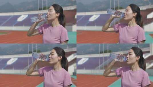 中国人女性运动后休息喝水饮用矿泉水高清在线视频素材下载