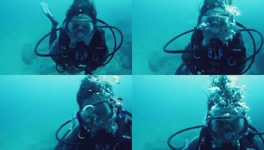 在蓝色海洋中潜水的人高清在线视频素材下载