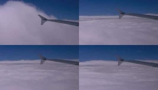 机翼贴着云层飞行高清在线视频素材下载