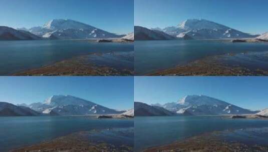 航拍新疆帕米尔高原壮丽湖泊和慕士塔格雪山高清在线视频素材下载