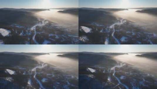 航拍云雾缭绕的冬季山林冰河高清在线视频素材下载