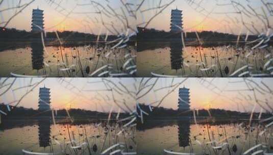 夕阳下的建筑长安塔  冬天的落日高清在线视频素材下载