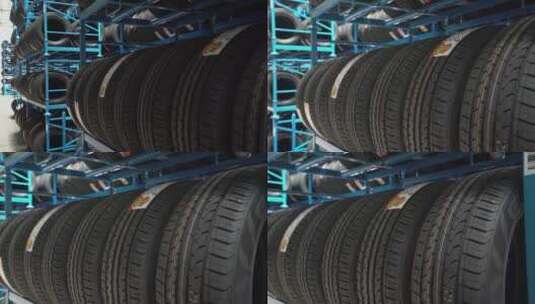 工人们在放满轮胎的物流仓库里装卸轮胎高清在线视频素材下载
