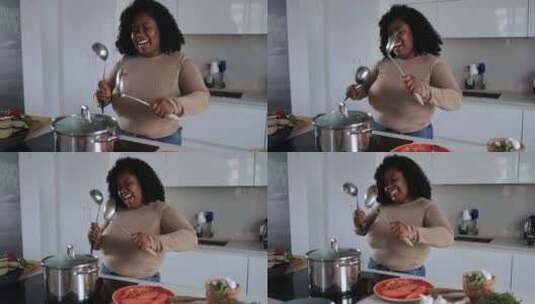 妇女在家厨房里做饭跳舞高清在线视频素材下载
