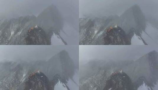 航拍登顶川西横断山脉乌库楚雪山的登山者高清在线视频素材下载