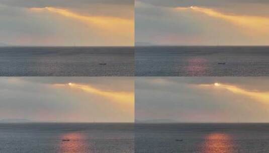 航拍威海西海岸小石岛海面落日余晖晚归渔船高清在线视频素材下载