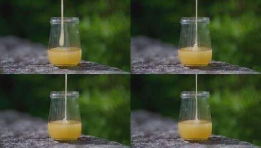 在玻璃瓶子倒入蜂蜜高清在线视频素材下载