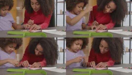 可爱的小黑人女孩和母亲的肖像缝纫手工儿童高清在线视频素材下载