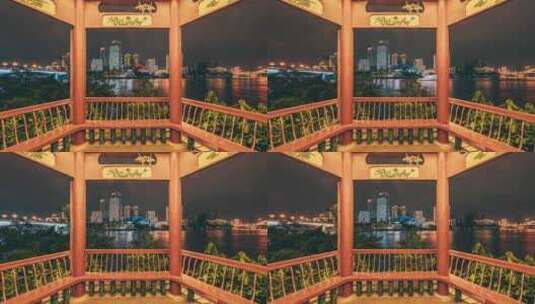 亭子内视角看游船-柳州江滨建筑夜景延时高清在线视频素材下载