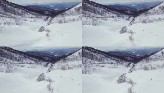 4k从山上滑雪下山航拍全景高清在线视频素材下载