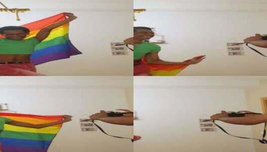 同性恋朋友挥舞同性恋旗帜时用相机拍照高清在线视频素材下载