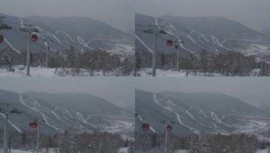 航拍吉林省吉林市北大湖滑雪场的吊厢缆车高清在线视频素材下载