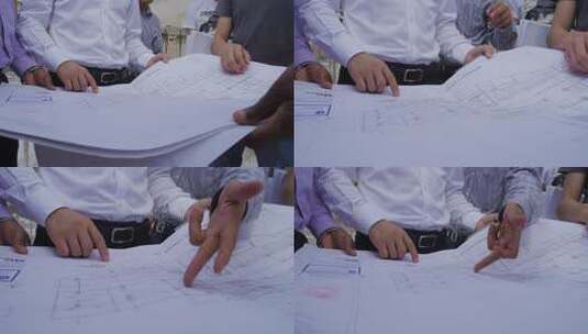 非洲坦桑尼亚工地工程师讨论建筑图纸细节高清在线视频素材下载