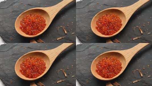 木勺中红色胶囊微距特写高清在线视频素材下载