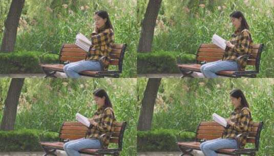中国女性美女在公园树林看书学习高清在线视频素材下载