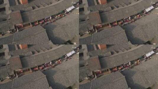 四川乐山古镇瓦片屋顶航拍行人走在老街赶集高清在线视频素材下载