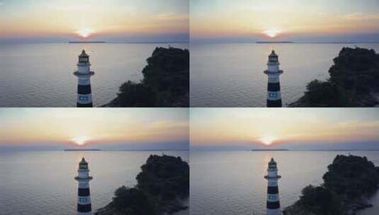 夕阳下航拍海边的灯塔高清在线视频素材下载