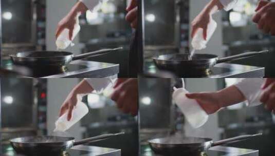 向平底锅里倒油的厨师高清在线视频素材下载