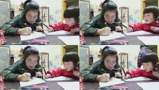 4K家庭画画的两个小孩女孩高清在线视频素材下载