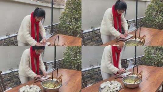 济南南部山区山乡后院，春节小院内包饺子高清在线视频素材下载