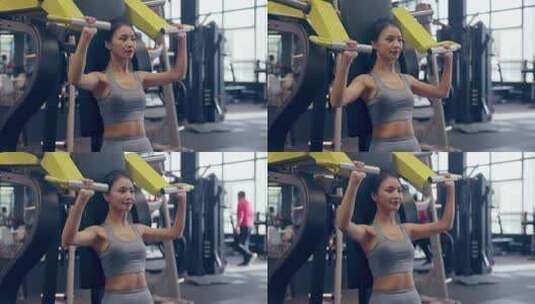穿运动内衣在健身房锻炼的年轻女性高清在线视频素材下载