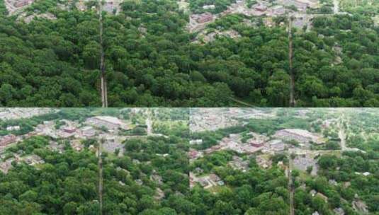 无人机航拍森林中的城镇高清在线视频素材下载