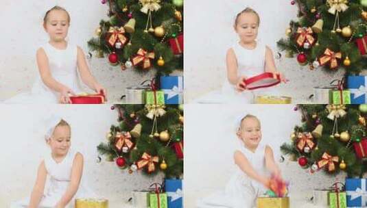 女孩坐在圣诞树抛洒五彩纸屑高清在线视频素材下载