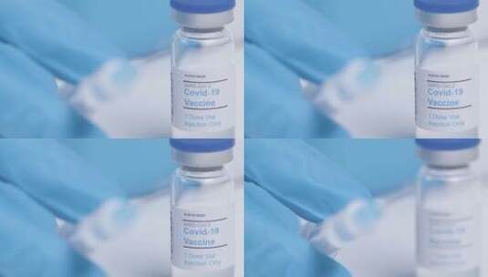 从肺炎疫苗瓶标签到注射器的焦点转移高清在线视频素材下载