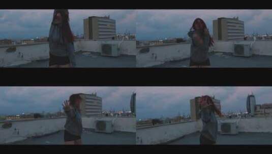 女孩站在楼顶跳舞高清在线视频素材下载