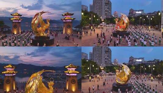 江边夜景金色凤凰雕塑景观高清在线视频素材下载