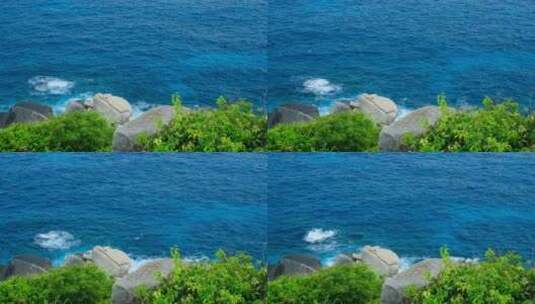 海南三亚海景大海边蓝色海浪拍打礁石岩石高清在线视频素材下载