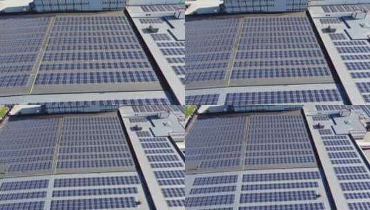 空中显示挪威卑尔根郊外asko工业建筑屋顶上的7546块太阳能电池板高清在线视频素材下载