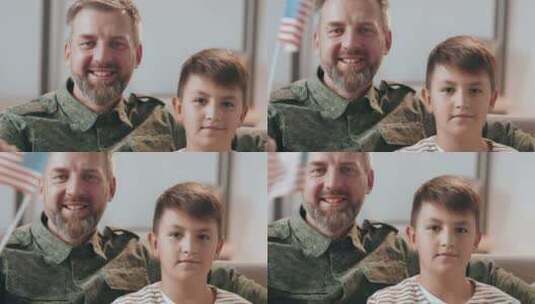 父亲与儿子坐在沙发上挥动美国国旗高清在线视频素材下载