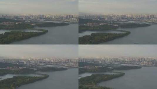 航拍武汉东湖绿道傍晚远处城市地平线高清在线视频素材下载