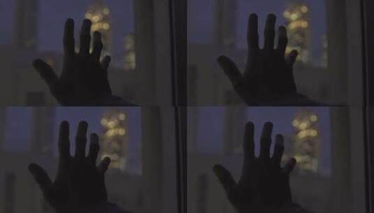 悲伤孤独的人在夜晚触摸玻璃窗外美景高清在线视频素材下载