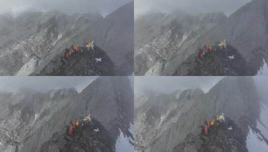 航拍登顶川西横断山脉乌库楚雪山的登山者高清在线视频素材下载