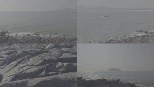海边黑色的礁石海浪晴天火山岛高清在线视频素材下载