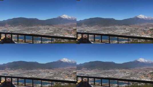 蓝天下从云南象山山顶欣赏远处的玉龙雪山高清在线视频素材下载