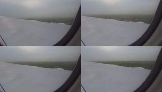 透过飞机窗户，可以看到飞机飞过美丽的云层高清在线视频素材下载