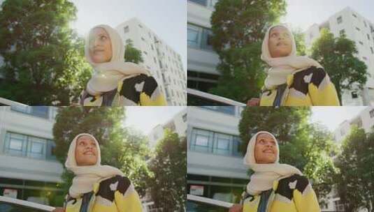 戴头巾的年轻女人在城里走来走去高清在线视频素材下载