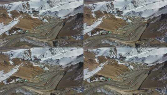 航拍蜿蜒的盘龙古道雪山公路高清在线视频素材下载