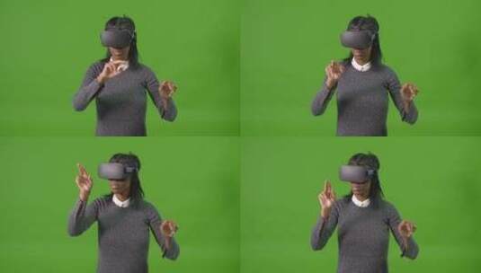绿幕前戴虚拟现实眼镜的女人高清在线视频素材下载