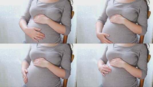 放松摸着肚子的孕妇高清在线视频素材下载