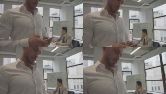男人在会议室玩智能手机高清在线视频素材下载