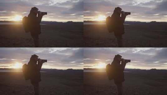 日落时拍照的摄影师高清在线视频素材下载