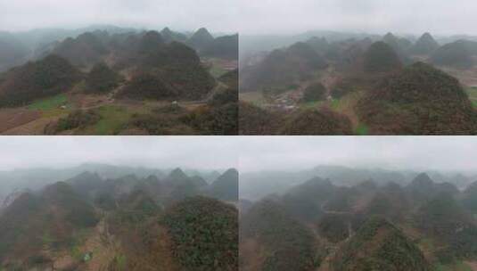 4k航拍阴天云雾下的田园群山丘陵高清在线视频素材下载