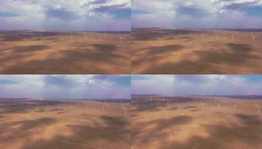 腾格里沙漠中的风力发电机高清在线视频素材下载