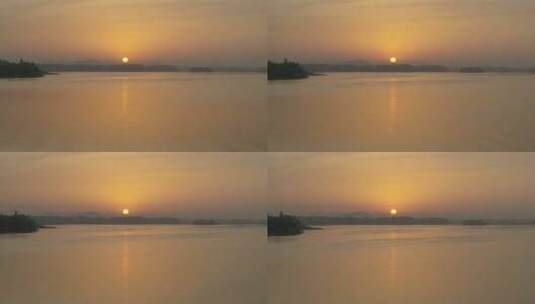 航拍武汉东湖绿道傍晚湖面太阳空镜高清在线视频素材下载