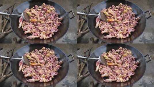 在农村生火烹饪鸭肉高清在线视频素材下载