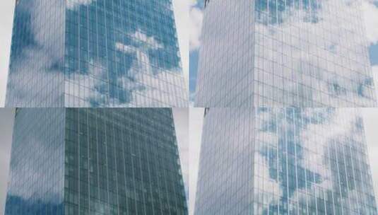 玻璃摩天大楼的时间流逝，云彩反射在办公室窗户上高清在线视频素材下载